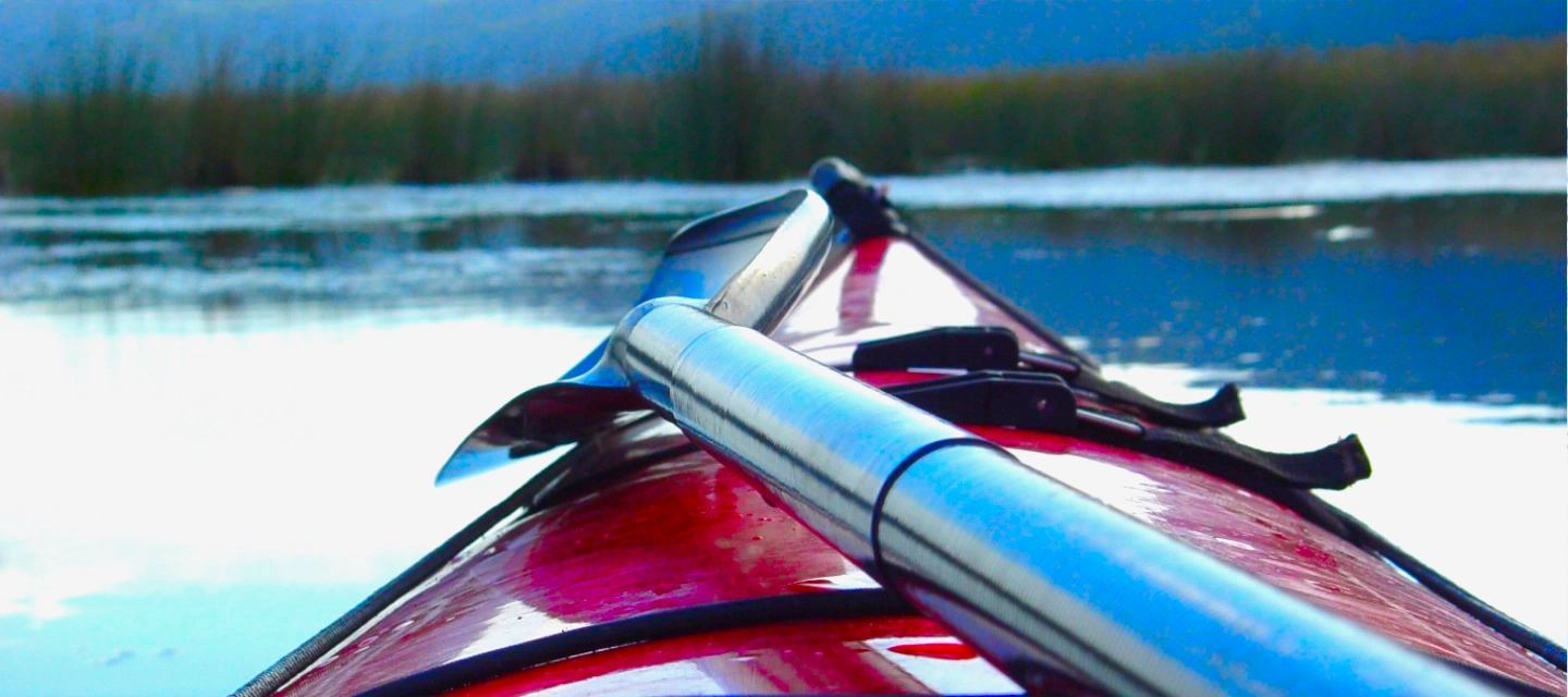 Experience the tranquility of a canoe gliding through the waters of the Serpentine in Wilderness, Garden Route, South Africa